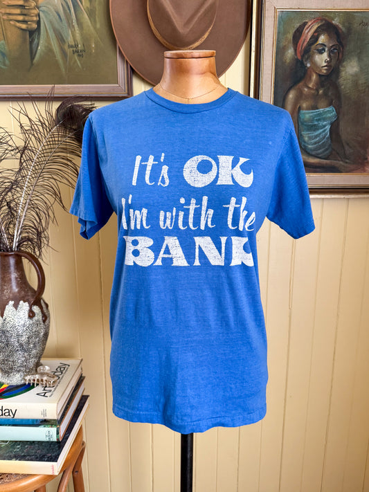 VINTAGE 1980S IT’S OKAY, I’M WITH THE BAND NOVELTY PRINT TSHIRT S/M